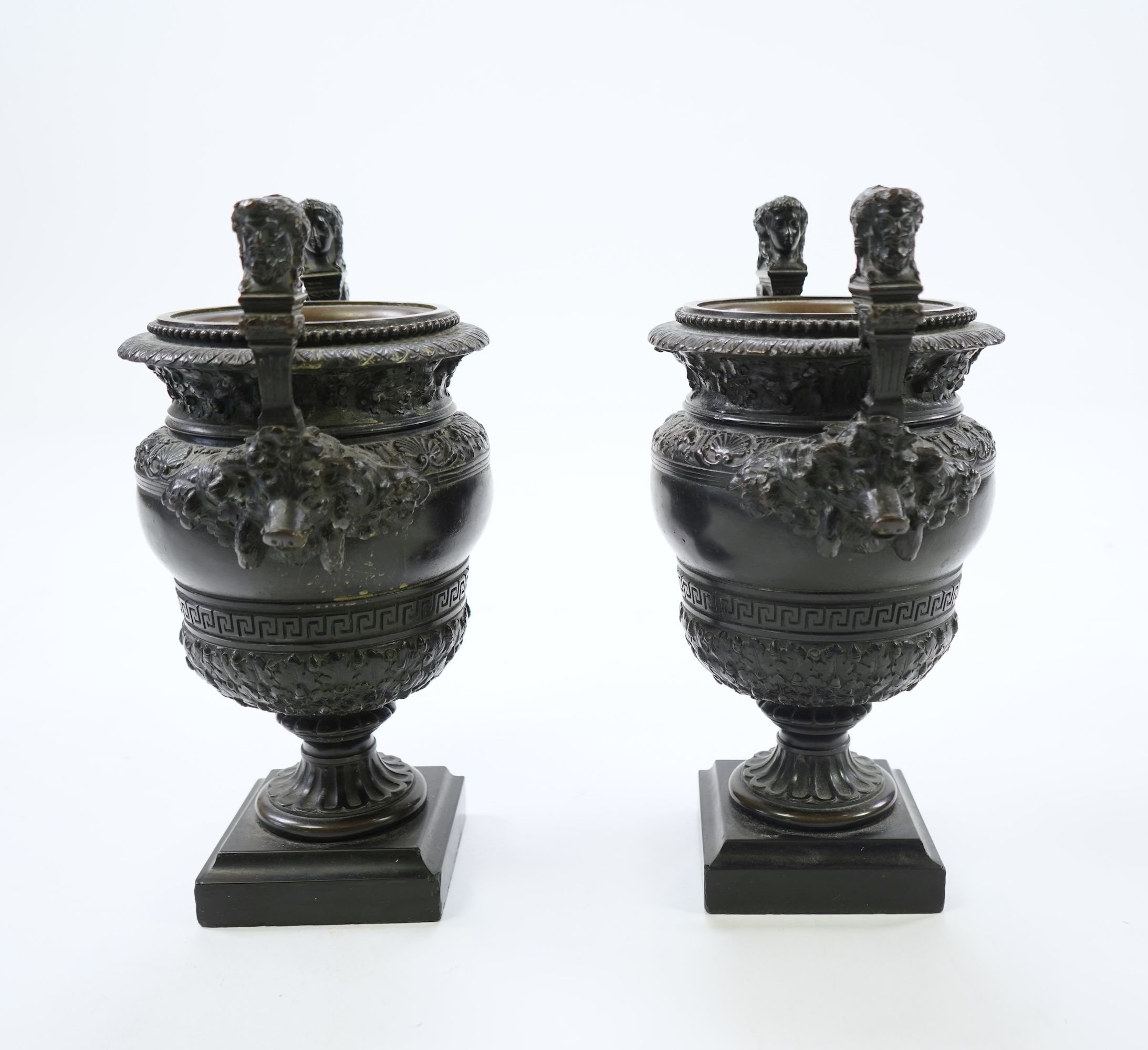 A pair of neoclassical revival bronze urns, late 19th century